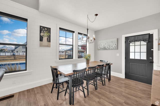 2282 N 3430 W, Clinton, UT 84015 - dining area featuring wood finished floors and a chandelier