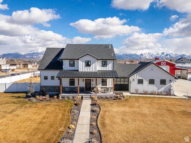 2282 N 3430 W, Clinton, UT 84015 - modern farmhouse featuring board and batten siding, a shingled roof, a porch, and a mountain view