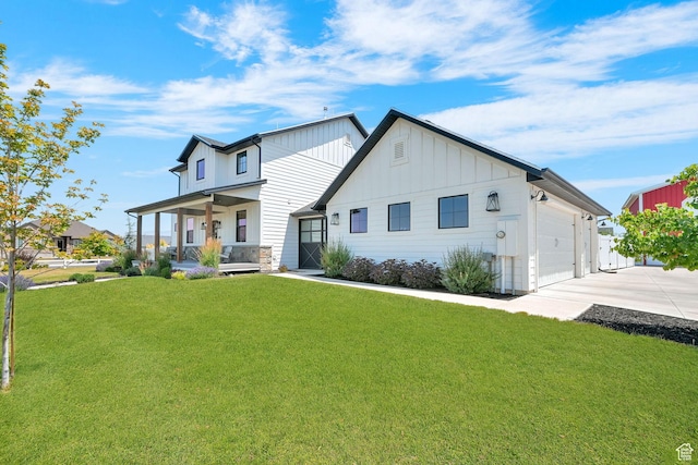 2282 N 3430 W, Clinton, UT 84015 - rear view of house featuring a porch, board and batten siding, a lawn, concrete driveway, and a garage
