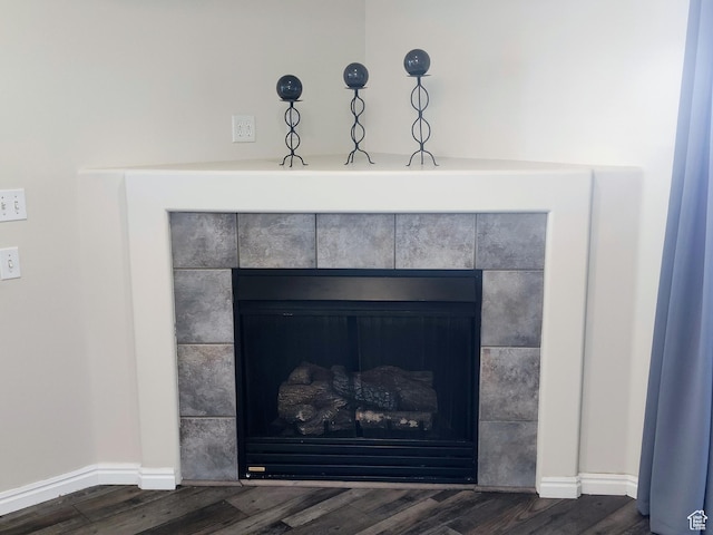 4443 S 1025 E # B2, Millcreek, UT 84124 - detailed view of a tile fireplace, wood finished floors, and baseboards