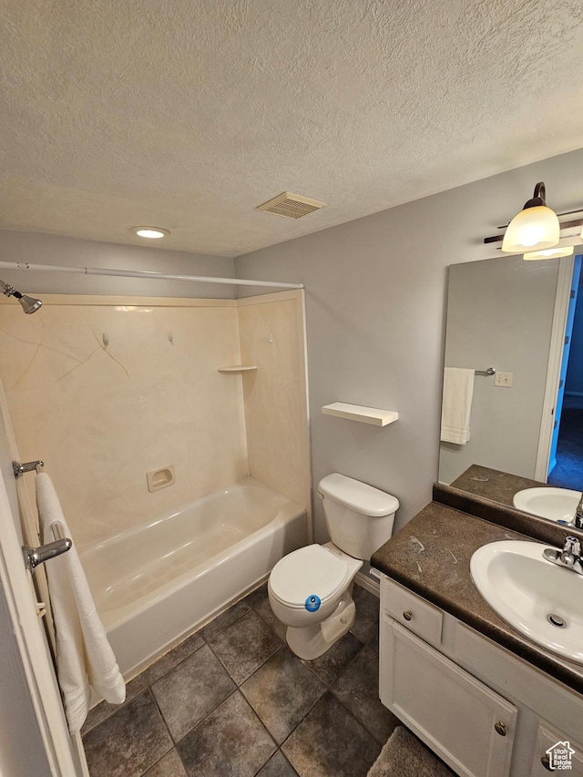 bathroom featuring bathing tub / shower combination, a textured ceiling, vanity, visible vents, and toilet
