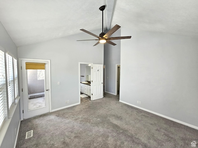 unfurnished bedroom featuring visible vents, baseboards, ensuite bath, high vaulted ceiling, and carpet flooring