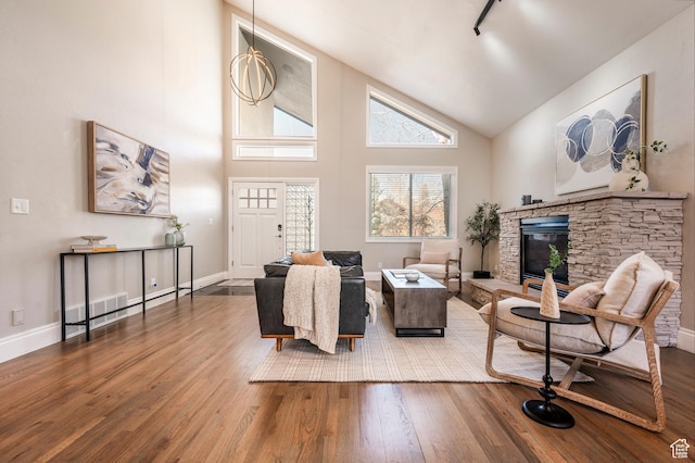 872 Martingale Ln, Park City, UT 84098 - living room with high vaulted ceiling, a fireplace, visible vents, wood-type flooring, and baseboards