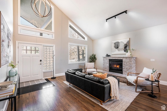 872 Martingale Ln, Park City, UT 84098 - living room featuring high vaulted ceiling, dark wood-style flooring, baseboards, and a stone fireplace