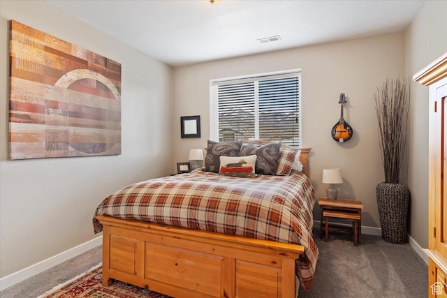 bedroom with visible vents, baseboards, and carpet flooring