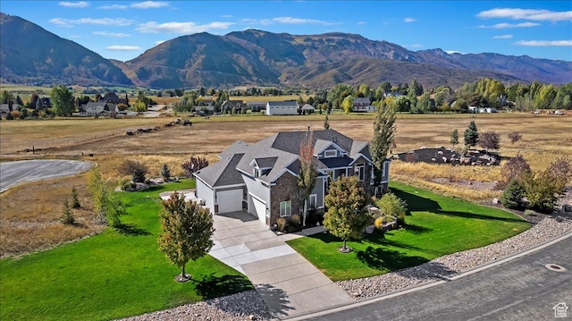 drone / aerial view featuring a mountain view