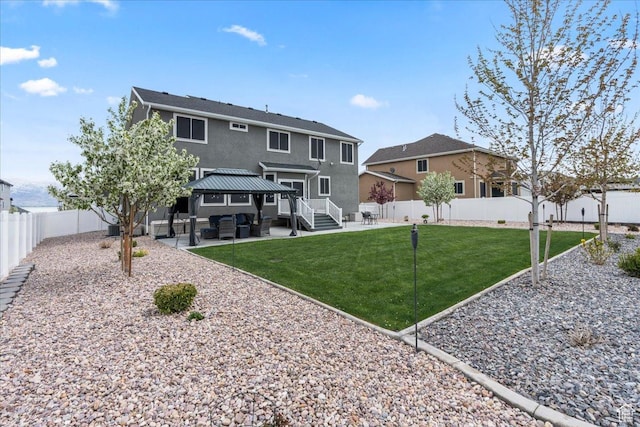 2913 S Puddle Ln, Saratoga Springs, UT 84045 - back of house featuring a fenced backyard, a gazebo, outdoor lounge area, a patio, and stucco siding