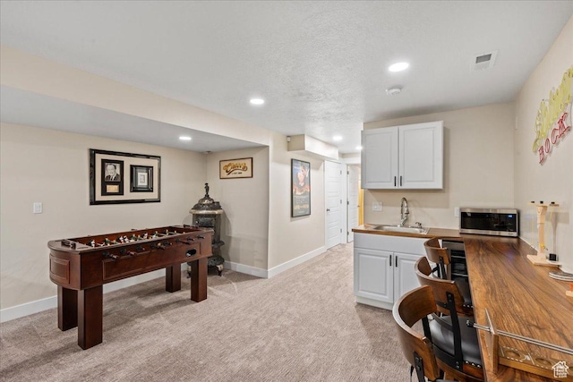 2913 S Puddle Ln, Saratoga Springs, UT 84045 - playroom with recessed lighting, visible vents, a sink, baseboards, and light colored carpet