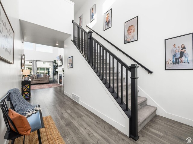 667 S Meade St, Mapleton, UT 84664 - stairs featuring a high ceiling, baseboards, and wood finished floors