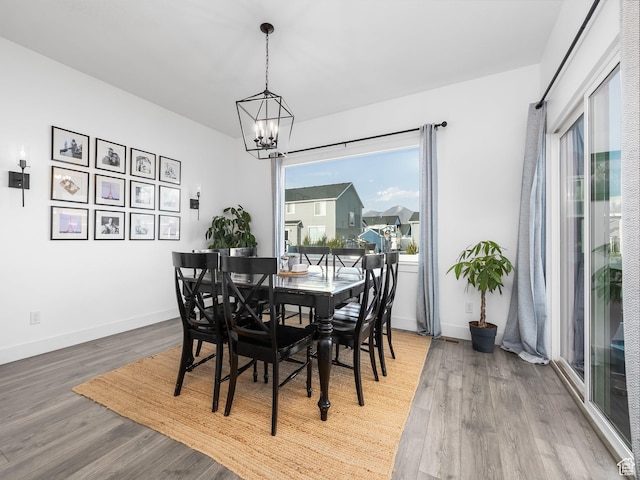 667 S Meade St, Mapleton, UT 84664 - dining space with wood finished floors, an inviting chandelier, and baseboards