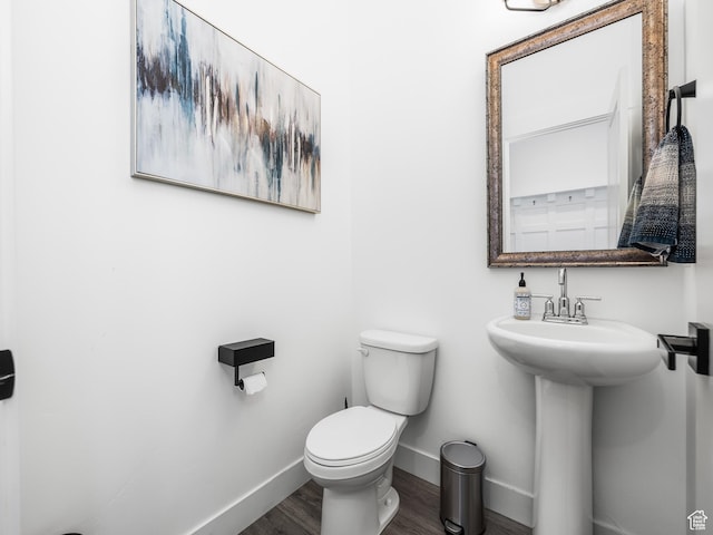667 S Meade St, Mapleton, UT 84664 - half bath with a sink, toilet, wood finished floors, and baseboards