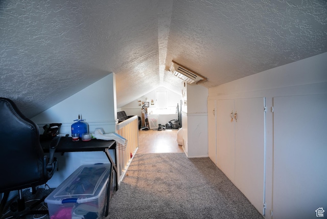 190 S Broadway St, Tooele, UT 84074 - bonus room with carpet floors, a wall mounted AC, vaulted ceiling, and a textured ceiling
