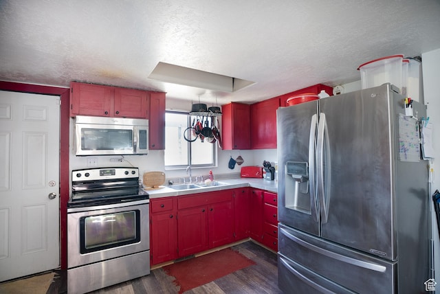 190 S Broadway St, Tooele, UT 84074 - kitchen featuring a sink, light countertops, a textured ceiling, stainless steel appliances, and dark wood-type flooring