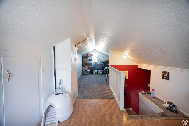 190 S Broadway St, Tooele, UT 84074 - additional living space featuring a textured ceiling, wood finished floors, and lofted ceiling