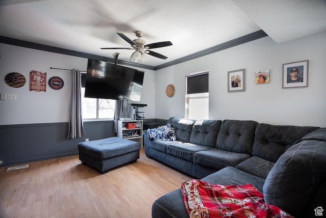 190 S Broadway St, Tooele, UT 84074 - living area featuring crown molding, wood finished floors, a ceiling fan, and visible vents