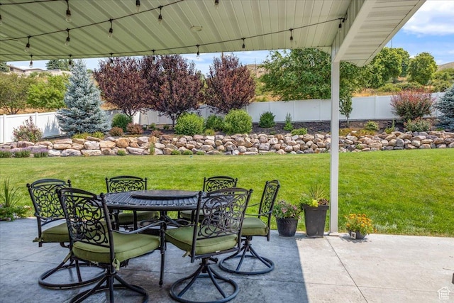 view of patio / terrace with outdoor dining space and fence