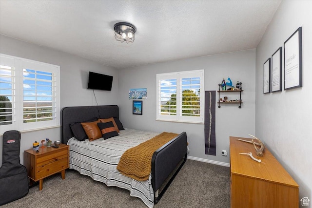 carpeted bedroom with baseboards