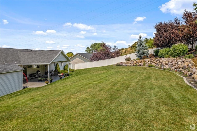 view of yard featuring a patio area and fence