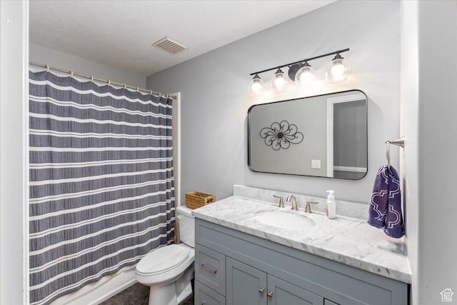 bathroom featuring visible vents, toilet, curtained shower, and vanity