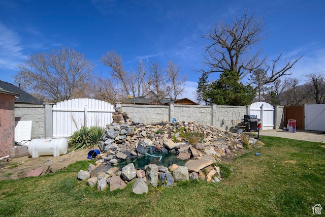12640 S 1565 E, Draper, UT 84020 - view of yard featuring a fenced backyard and a gate