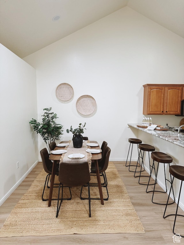 374 N 1100 E Unit F3, Lehi, UT 84043 - dining space featuring light wood finished floors, baseboards, and high vaulted ceiling