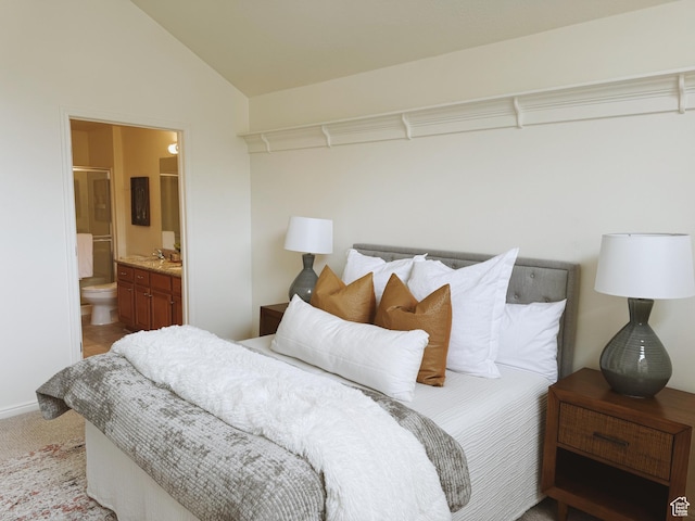 374 N 1100 E Unit F3, Lehi, UT 84043 - bedroom with vaulted ceiling, connected bathroom, a sink, carpet floors, and baseboards
