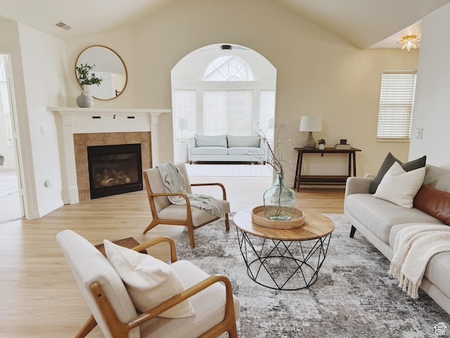 374 N 1100 E Unit F3, Lehi, UT 84043 - living room with a tile fireplace, vaulted ceiling, wood finished floors, and visible vents