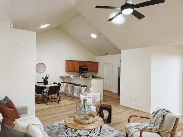 374 N 1100 E Unit F3, Lehi, UT 84043 - living area with high vaulted ceiling, light wood-style floors, ceiling fan, baseboards, and recessed lighting
