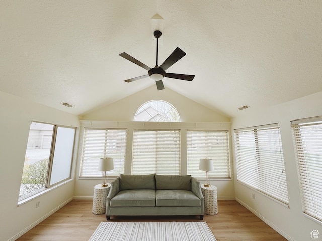 374 N 1100 E Unit F3, Lehi, UT 84043 - living room with vaulted ceiling, light wood-type flooring, a textured ceiling, and a ceiling fan