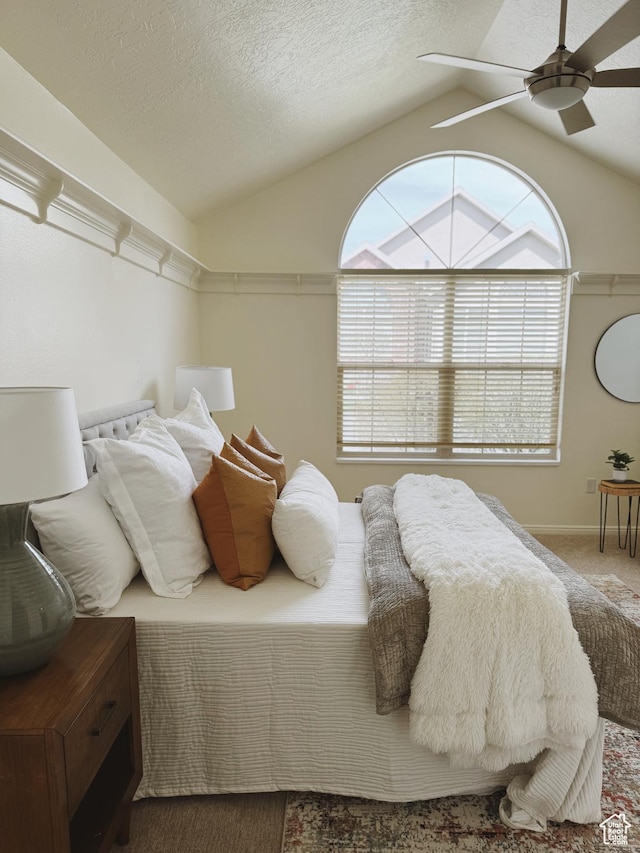 374 N 1100 E Unit F3, Lehi, UT 84043 - bedroom with a textured ceiling, vaulted ceiling, baseboards, a ceiling fan, and carpet floors