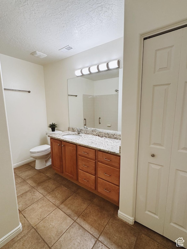 374 N 1100 E Unit F3, Lehi, UT 84043 - full bath featuring a textured ceiling, vanity, baseboards, toilet, and visible vents