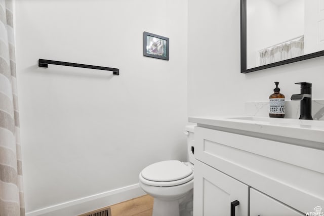 3567 N Lakeview Ct, Eden, UT 84310 - full bath with toilet, wood finished floors, vanity, and baseboards