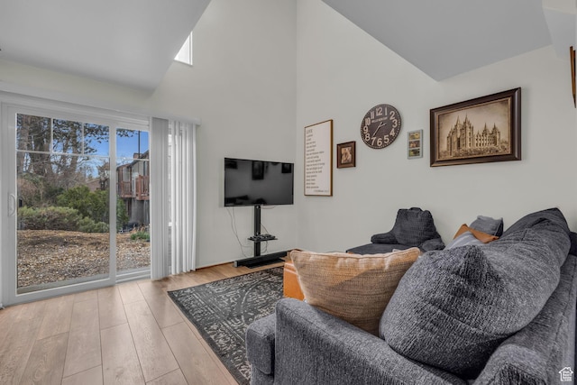 490 E Tonalea Dr, Murray, UT 84107 - living room featuring wood finished floors and high vaulted ceiling