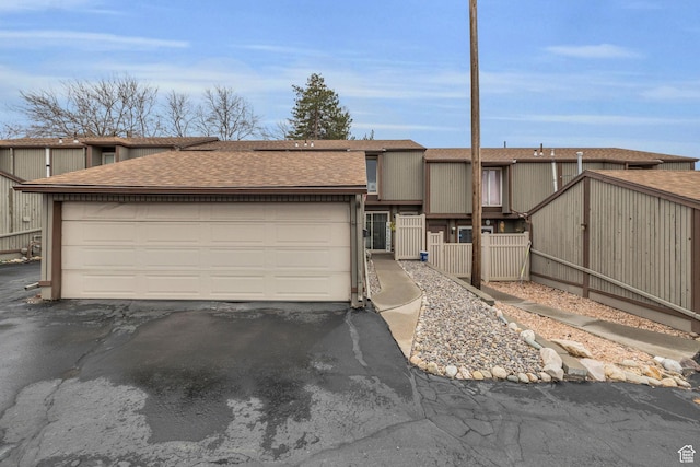 490 E Tonalea Dr, Murray, UT 84107 - view of front of home with a gate, driveway, a garage, fence, and a shingled roof
