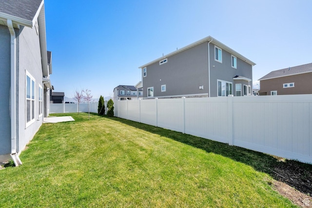 view of yard with a fenced backyard