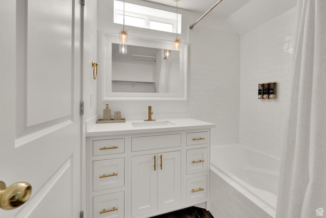 full bath featuring shower / bath combo with shower curtain and vanity