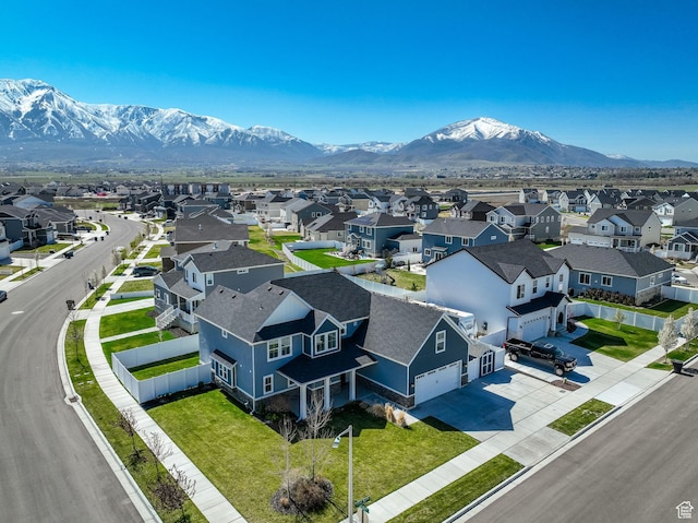 drone / aerial view with a mountain view and a residential view