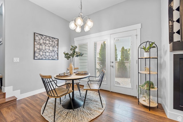 10609 S Kestrel Rise Rd, South Jordan, UT 84009 - dining room with french doors, a chandelier, wood finished floors, and stairs