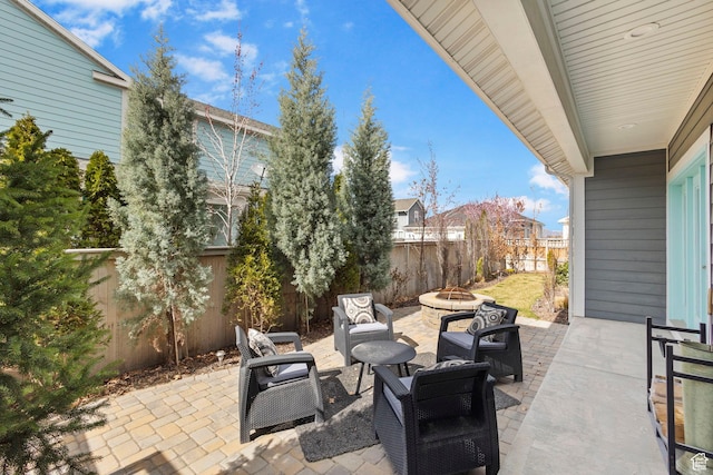 10609 S Kestrel Rise Rd, South Jordan, UT 84009 - view of patio / terrace featuring an outdoor living space with a fire pit and a fenced backyard