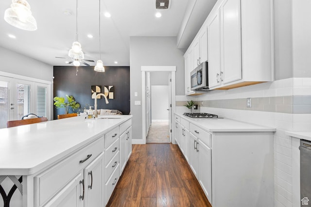 10609 S Kestrel Rise Rd, South Jordan, UT 84009 - kitchen featuring recessed lighting, light countertops, white cabinets, appliances with stainless steel finishes, and a sink