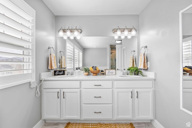 10609 S Kestrel Rise Rd, South Jordan, UT 84009 - full bath featuring a sink, baseboards, and double vanity