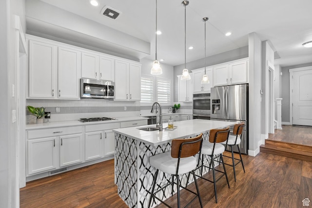 10609 S Kestrel Rise Rd, South Jordan, UT 84009 - kitchen with a sink, white cabinets, and stainless steel appliances