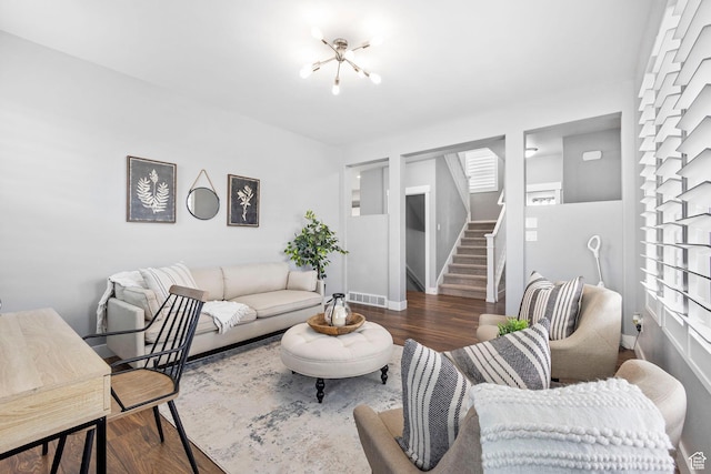 10609 S Kestrel Rise Rd, South Jordan, UT 84009 - living area featuring visible vents, baseboards, a chandelier, wood finished floors, and stairs