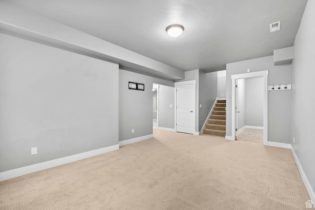 10609 S Kestrel Rise Rd, South Jordan, UT 84009 - finished basement with visible vents, baseboards, light carpet, and stairs