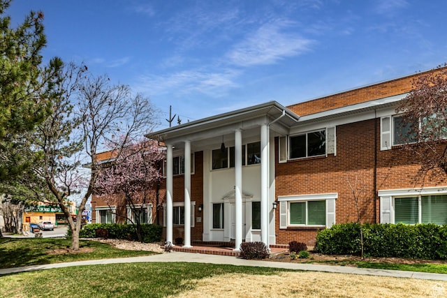 2710 S Highland Dr Unit 11, Salt Lake City, UT 84106 - greek revival inspired property featuring brick siding and a front lawn
