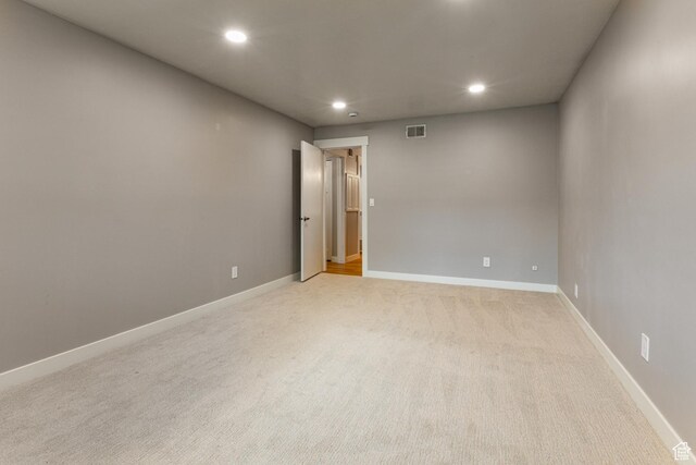 2710 S Highland Dr Unit 11, Salt Lake City, UT 84106 - spare room featuring visible vents, baseboards, recessed lighting, and light carpet