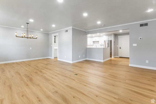 2710 S Highland Dr Unit 11, Salt Lake City, UT 84106 - unfurnished living room featuring light wood-style flooring, recessed lighting, a chandelier, and baseboards