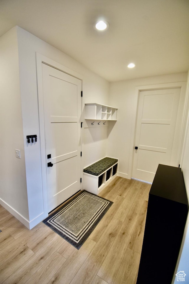 mudroom featuring light wood-type flooring, baseboards, and recessed lighting