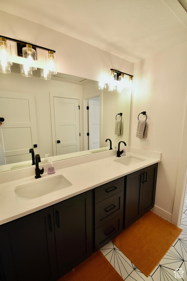 full bath with double vanity and a sink