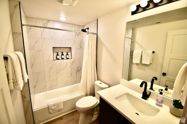 bathroom featuring a textured ceiling, vanity, visible vents, toilet, and shower / tub combo